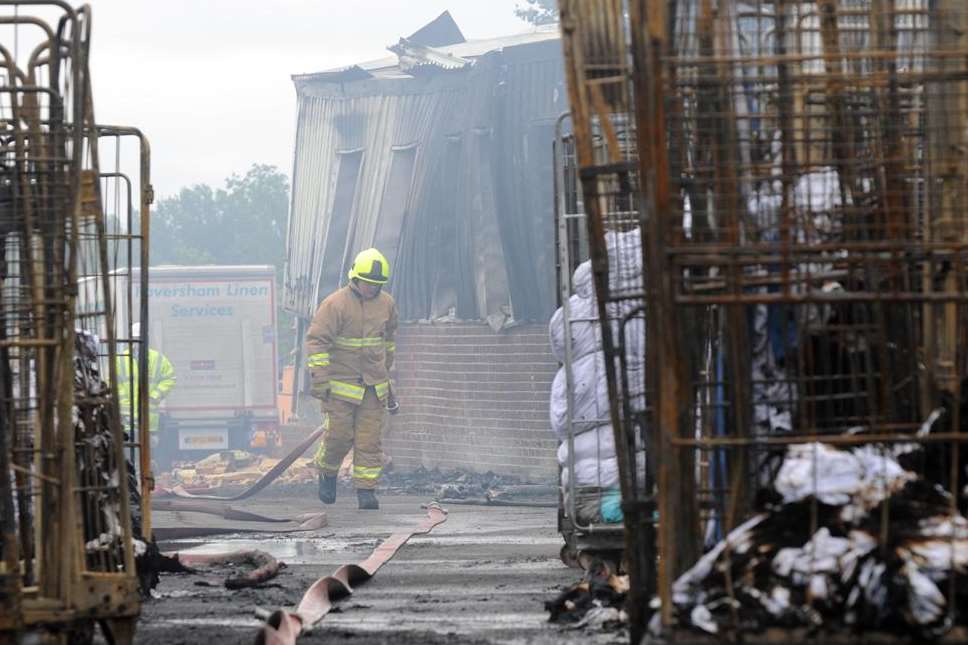 Firefighters at the site of the blaze at Faversham Linen Services