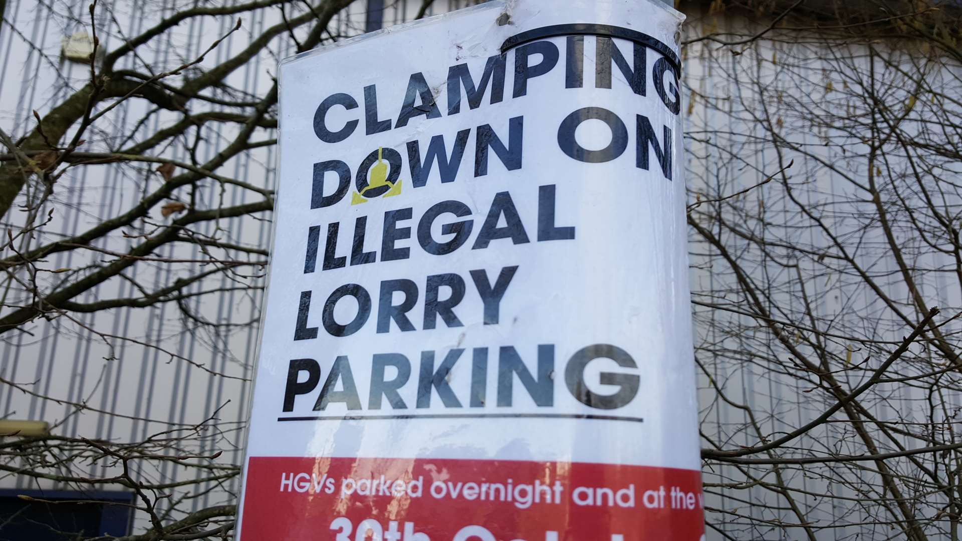 Signs warn lorry drivers of the clamping trial