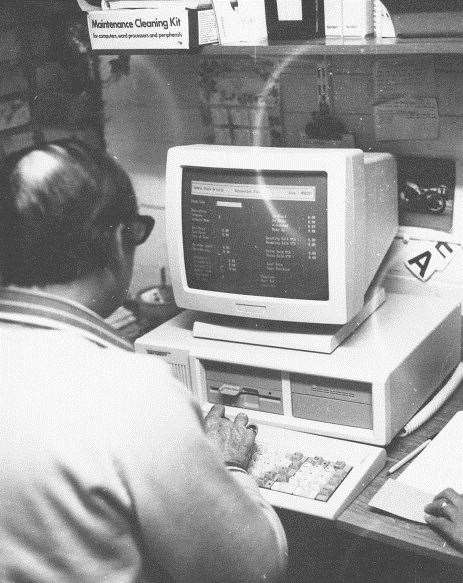 The firm's founder John Jones gets to work with the company's first computer which it invested in in 1987.