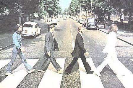 The Beatles with their original Abbey Road album cover
