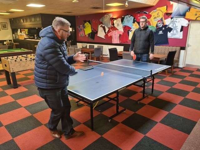 Club Chair Dan Mason (left) plays a game of table tennis with club joint captain Shaun Shoebridge (right)