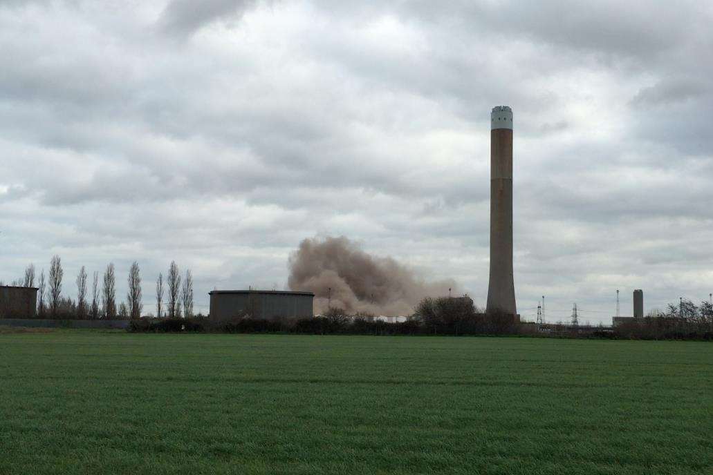 A cloud of dust over the former boiler houses when they were demolished in February