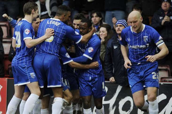 Charlie Lee celebrates with fellow Gills players after scoring against Bristol City Picture: Barry Goodwin