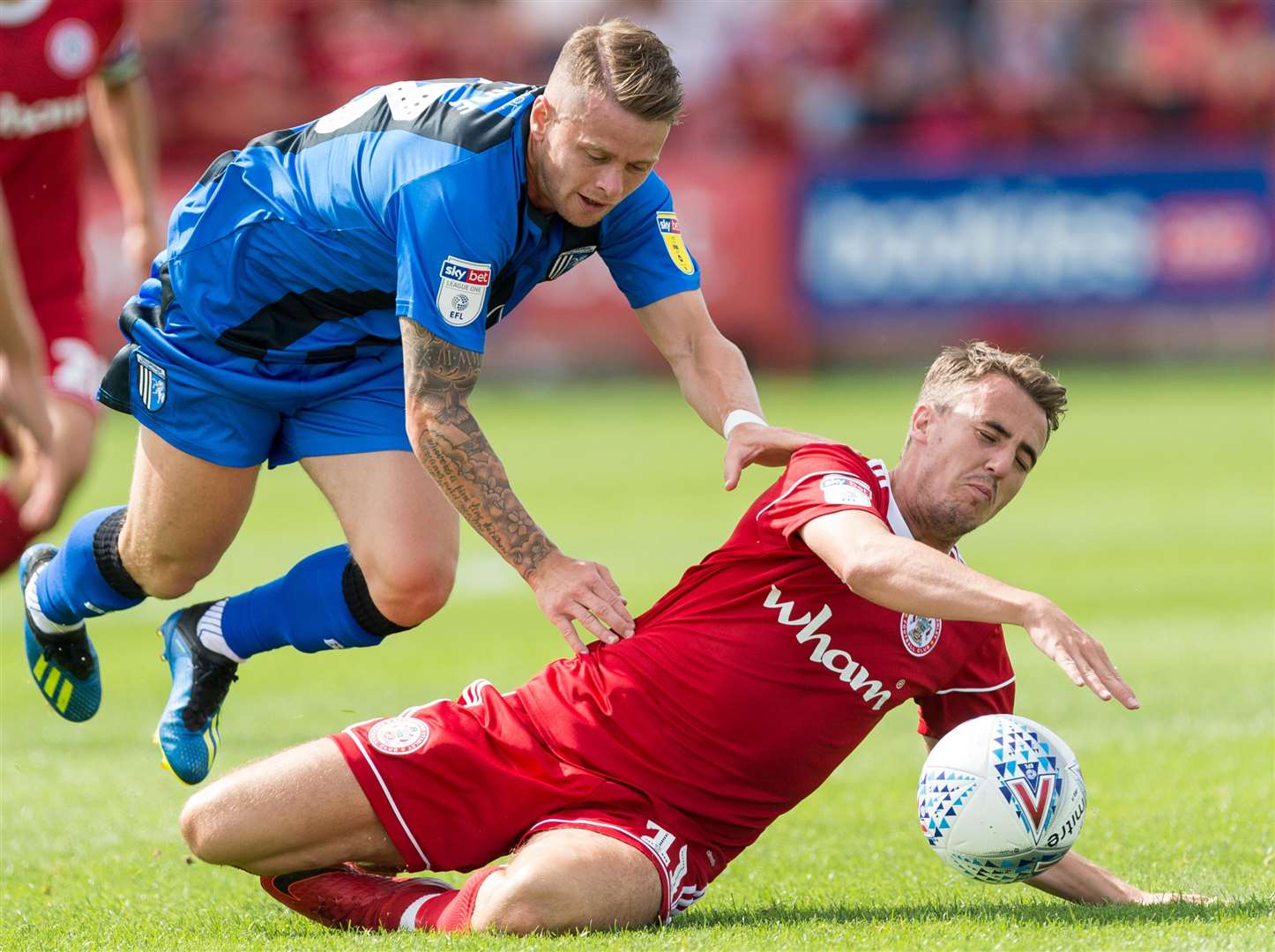 Gillingham's Mark Byrne challenges with Accrington's Sean McConville. Picture: Ady Kerry