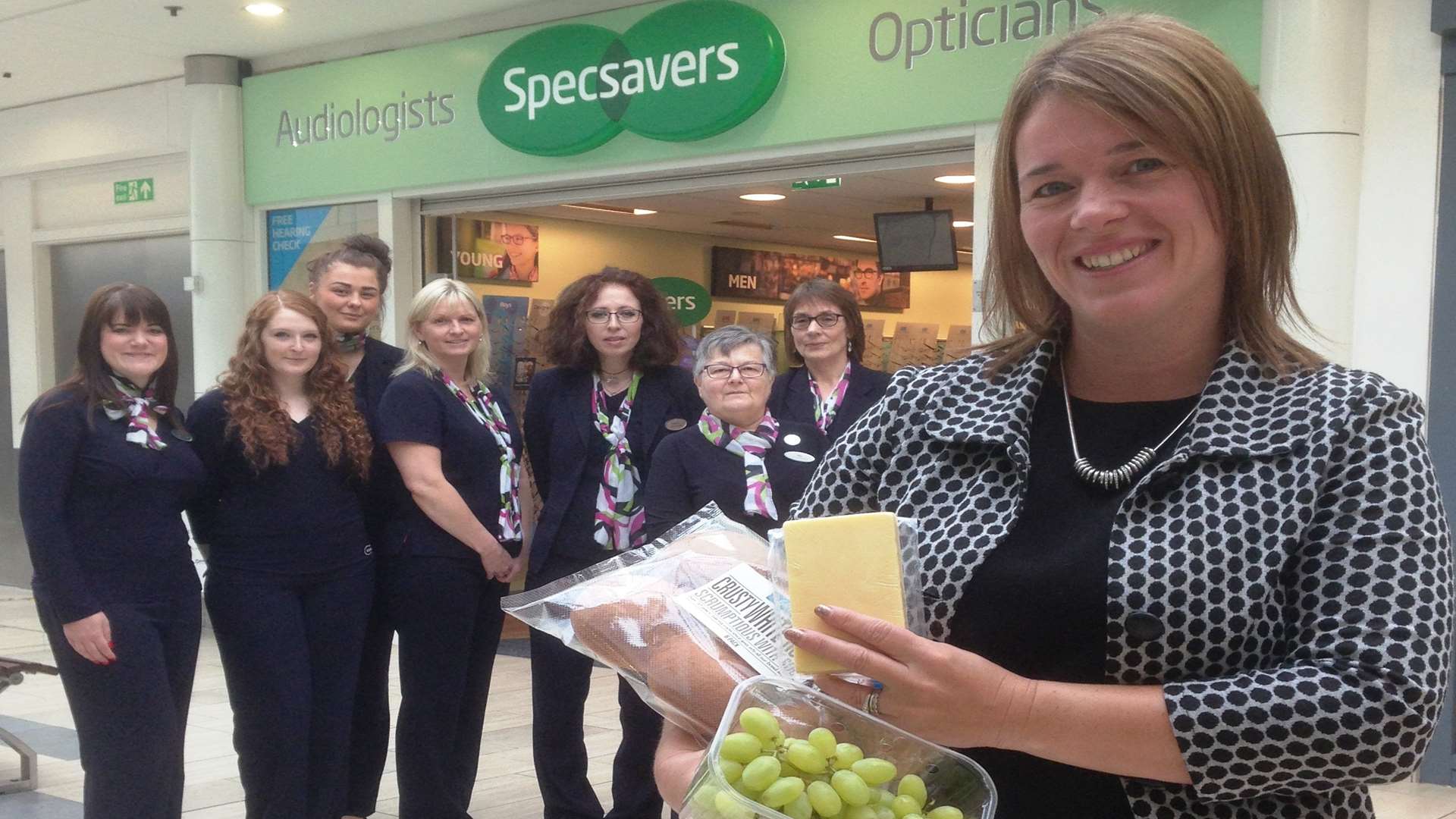 Helen Wathen, fundraising manager at Kent Multiple Sclerosis Therapy Centre which is providing the food for the Ashford Big Quiz, with the team at Specsavers Ashford - a key partner of the event.