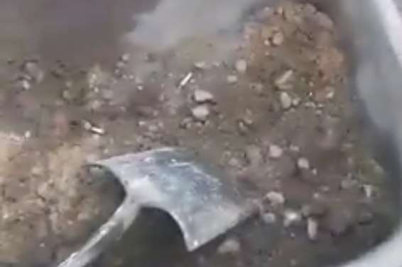 The video shows the cigarette butts in a wheelbarrow