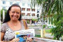 Gaynor Flint with her copy of the STG in Vietnam