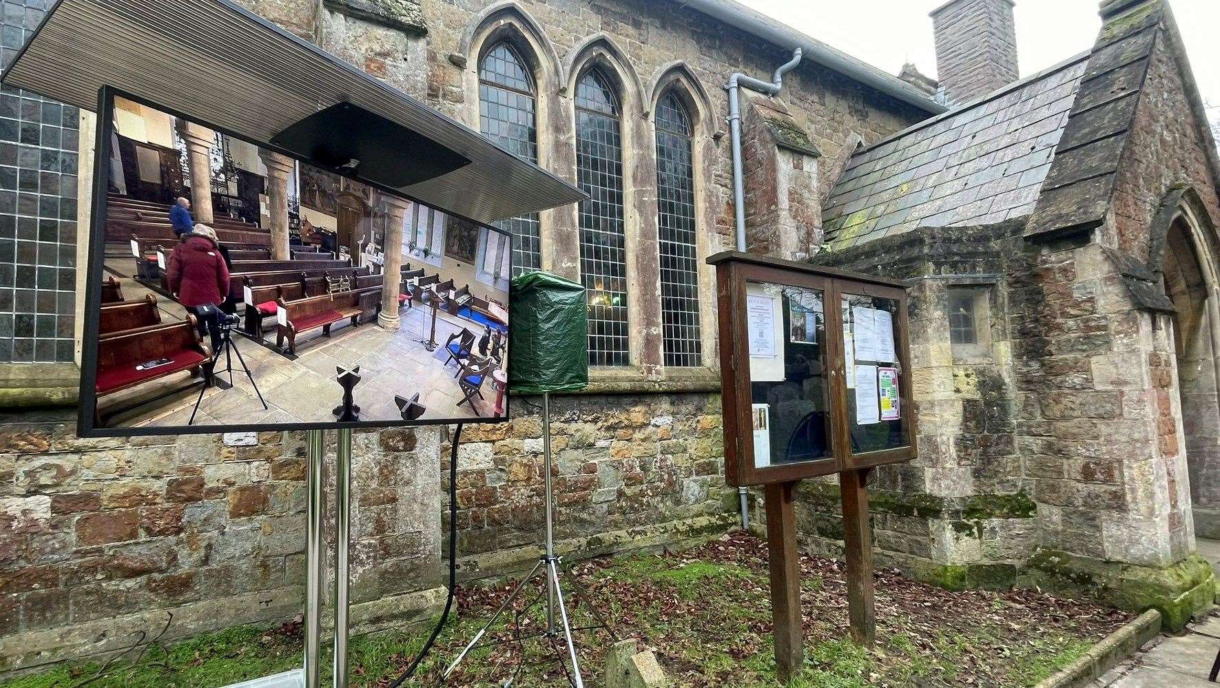 Screens have been put up outside The Church of St Mary and St Eanswythe in Folkestone so people can gather to watch William Brown's funeral. Picture: Gabriel Morris