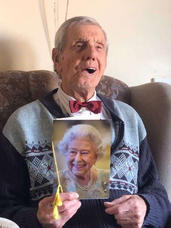 Charlie Pallett with his card from The Queen