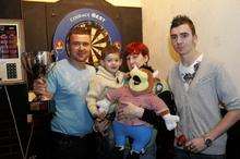 Charity Darts tournament to help raise money for the Oliver Smith appeal. Left to right, Barry Friday, Oliver Smith and his mum Natalie with James Friday.