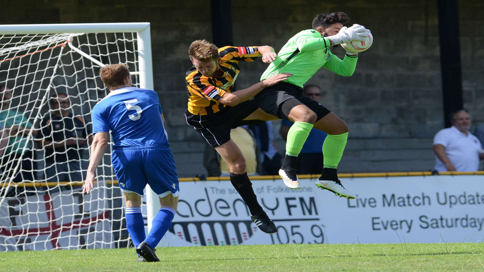Deren Ibrahim claims the ball ahead of Folkestone striker Carl Rook Picture: Gary Browne