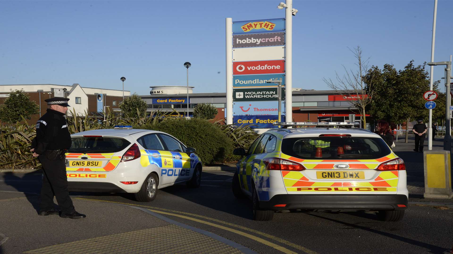 Police at The Link retail park the morning following the discovery of Carl Gregory's body