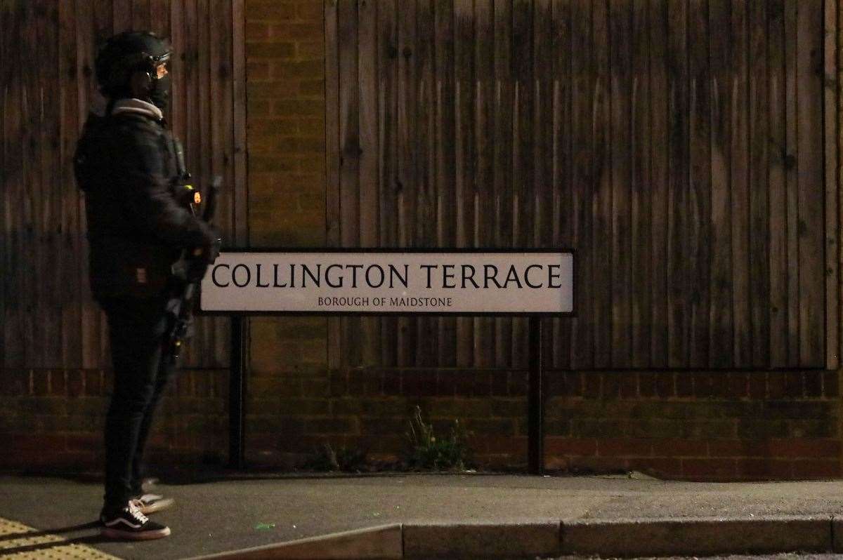 An officer stands guard at Collington Terrace in Maidstone's Park Wood estate. Pictures UKNIP