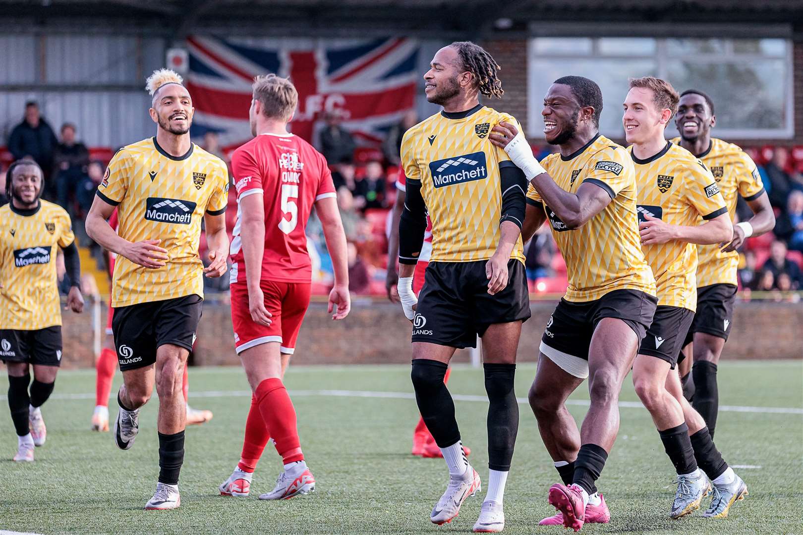 Delight for Lamar Reynolds after Maidstone team-mates after completing his hat-trick. Picture: Helen Cooper