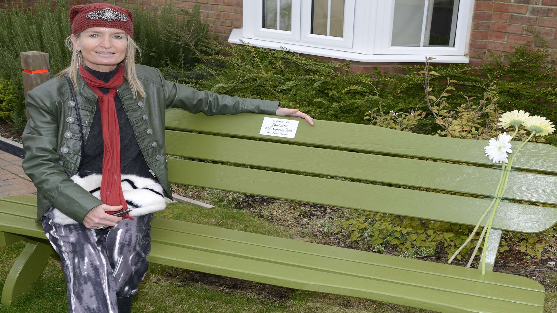 Hayley Denise Sawkins, left, with the memorial bench to her mother