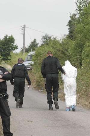 A suspect is arrested and led away. Picture: PETER STILL