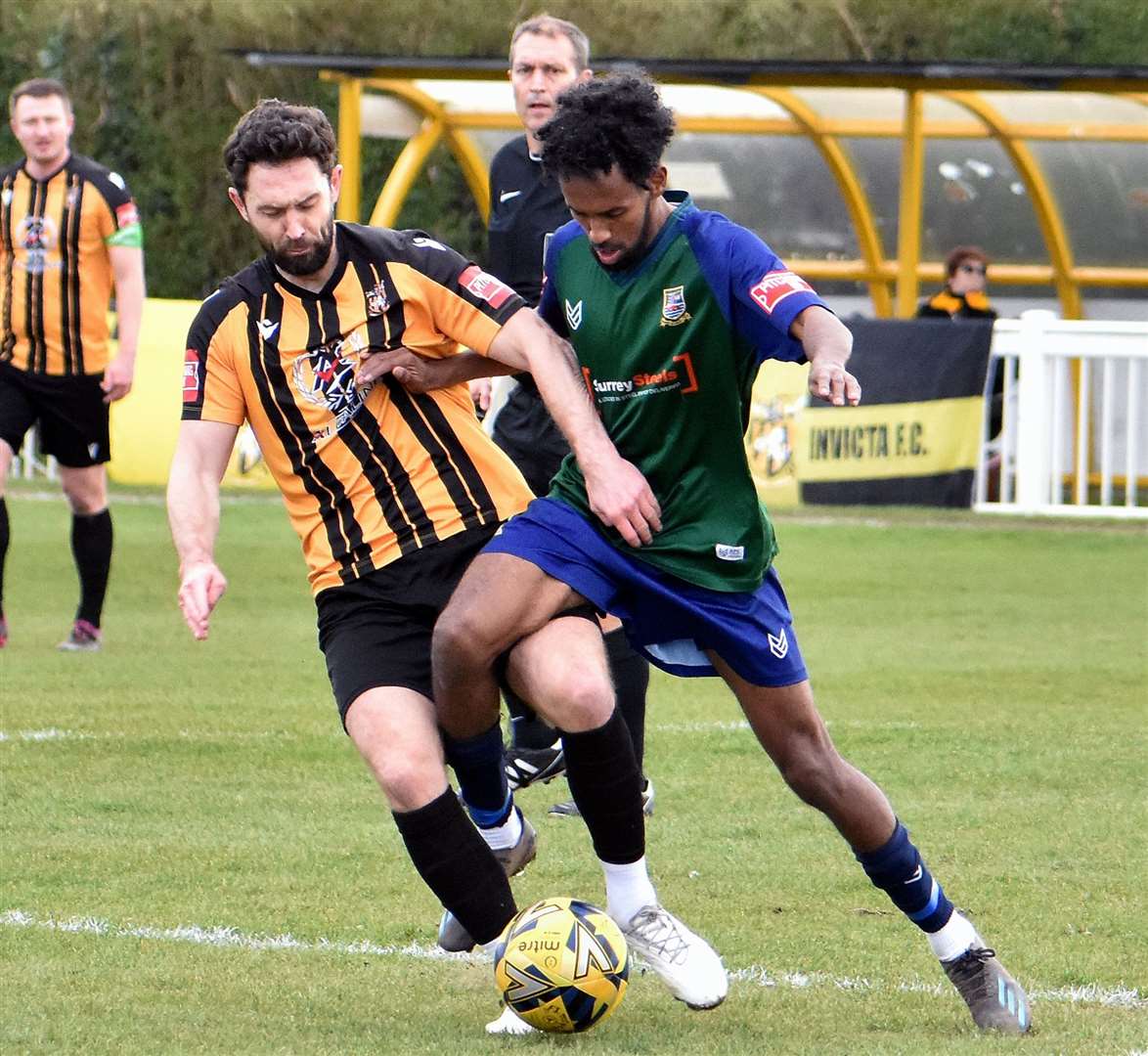 On-loan Folkestone midfielder Dean Rance is closed down by an away player at Cheriton Road. Picture: Randolph File