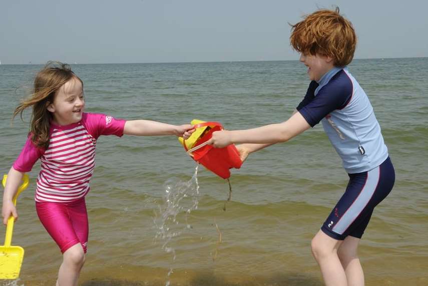 Ben and Ivy Trayner-Clarke cool off in the sea at Whitstable