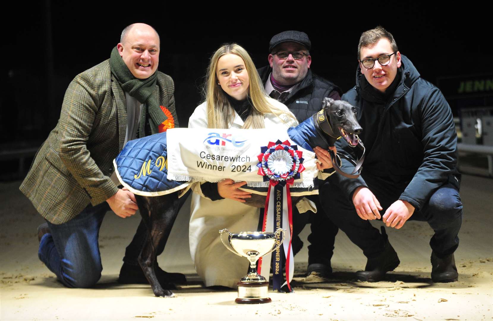 Garfiney Blaze and connections after Saturday's Cesarewitch Final win at Central Park. From left, co-owner Mike Davis, kennel hands Emily Wallis and Sid Huett and assistant trainer Daniel Wallis. Picture: Fortitude Communications