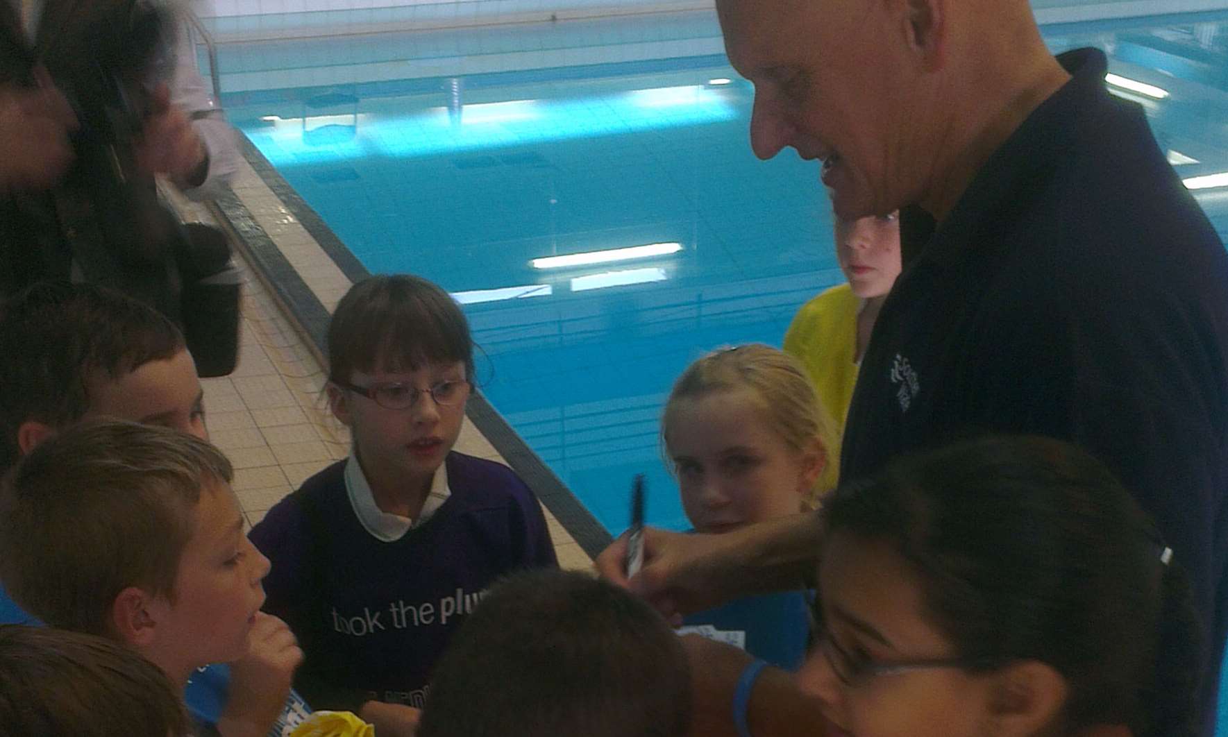 Duncan Goodhew signs autographs for young swimmers at Medway Park
