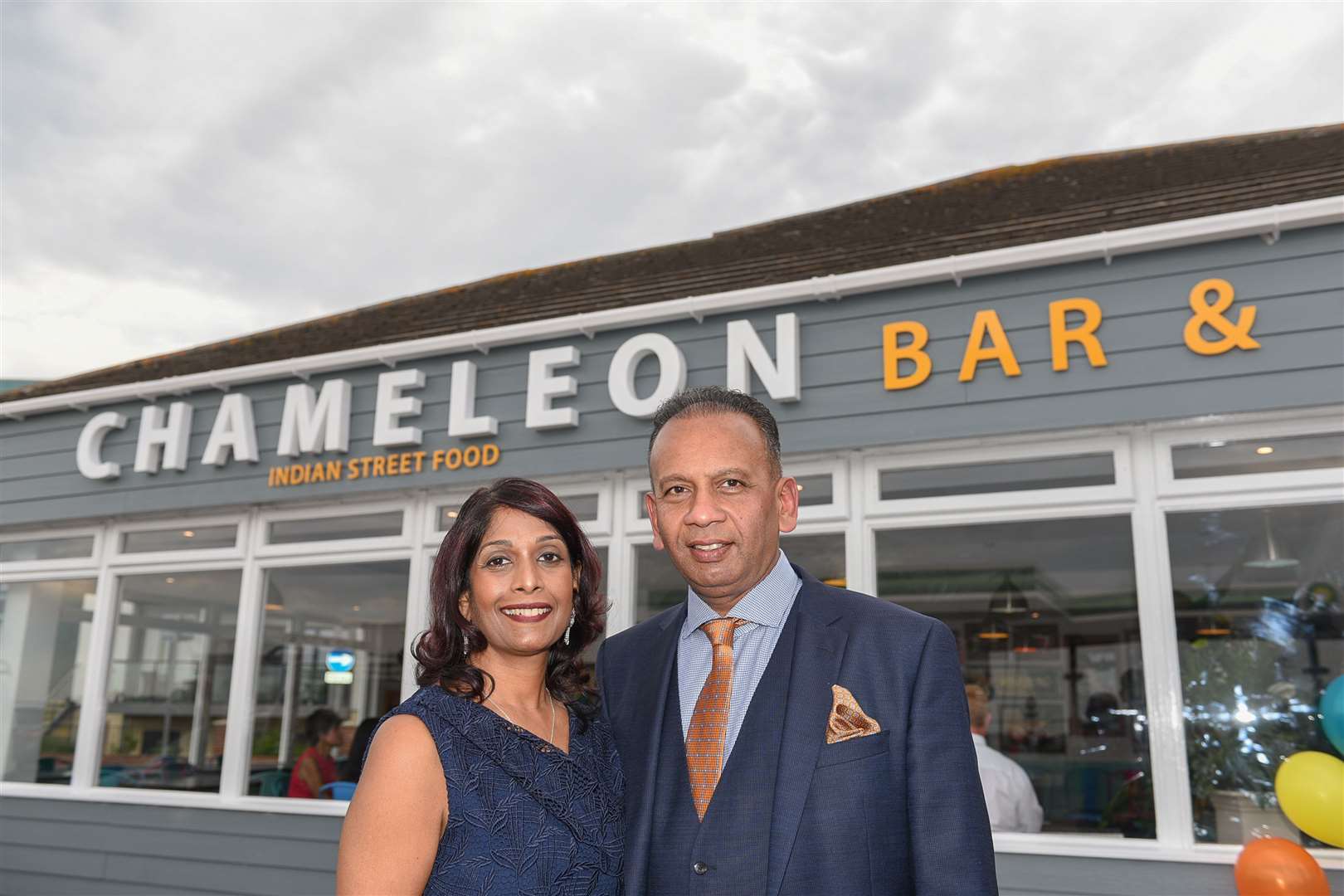 Mr Rajamenon has opened the Chameleon Bar & Grill in Hythe, pictured with wife Anusha