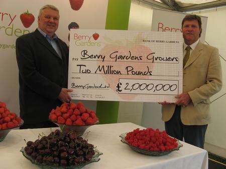 Nick Marston, managing director of Berry Gardens, and Paul Kelsey, chairman, celebrate record payout to fruit growers at Fruit Focus