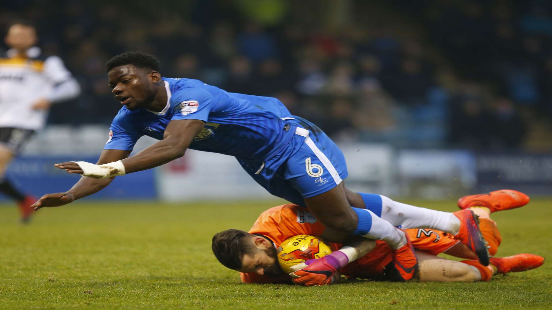 Port Vale keeper Leonardo Fasan just beats Deji Oshilaja to the ball Picture: Andy Jones