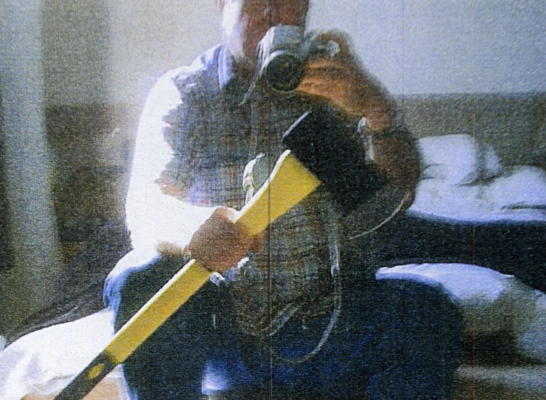 Bolinger poses with an axe - a picture which was shown to the jury during his 2014 trial
