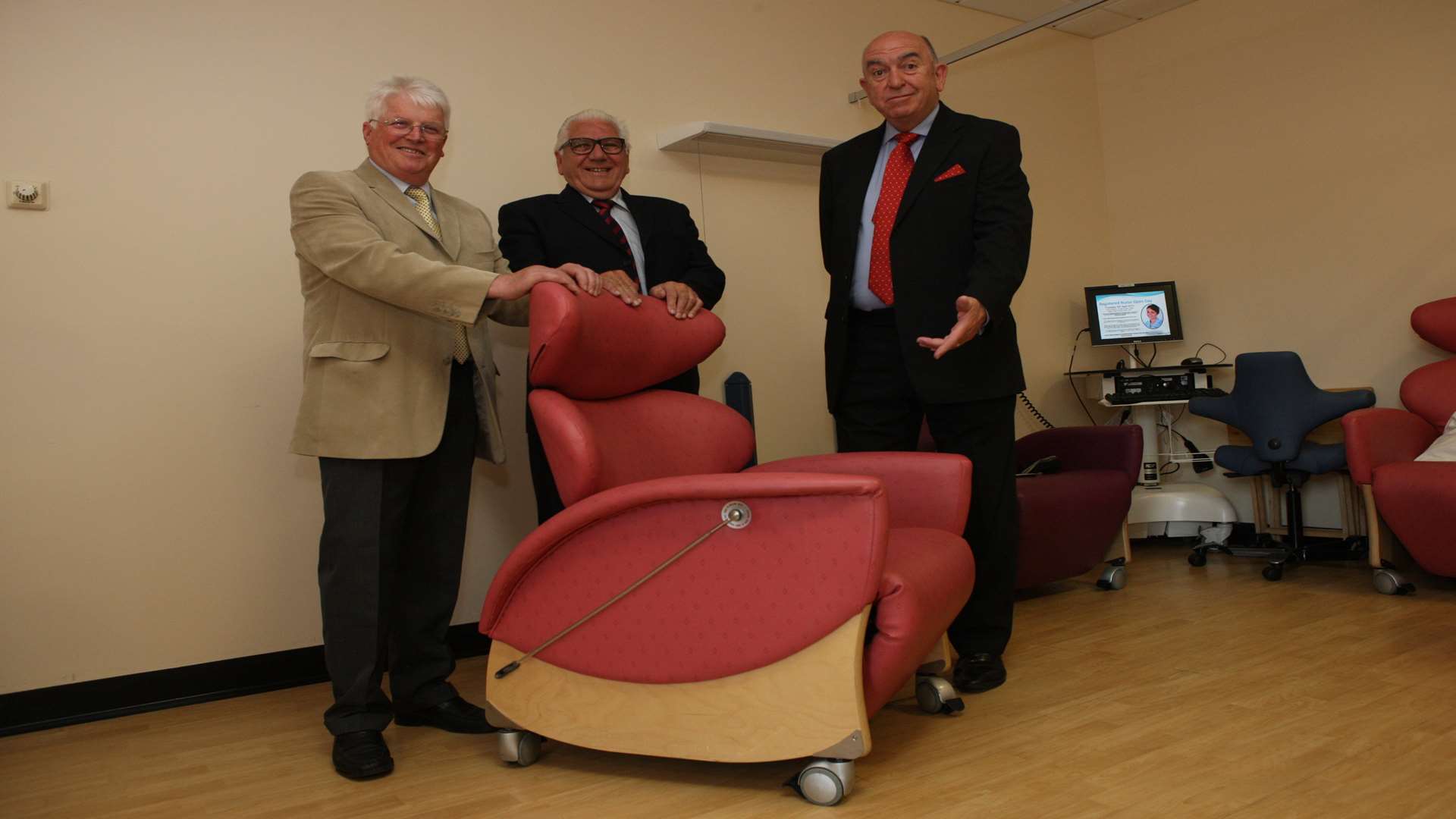 From left, Brendan Casey, TJ McDonagh, former cancer patient, and Mike Fitzpatrick with the specialist chairs at Darent Valley Hospital