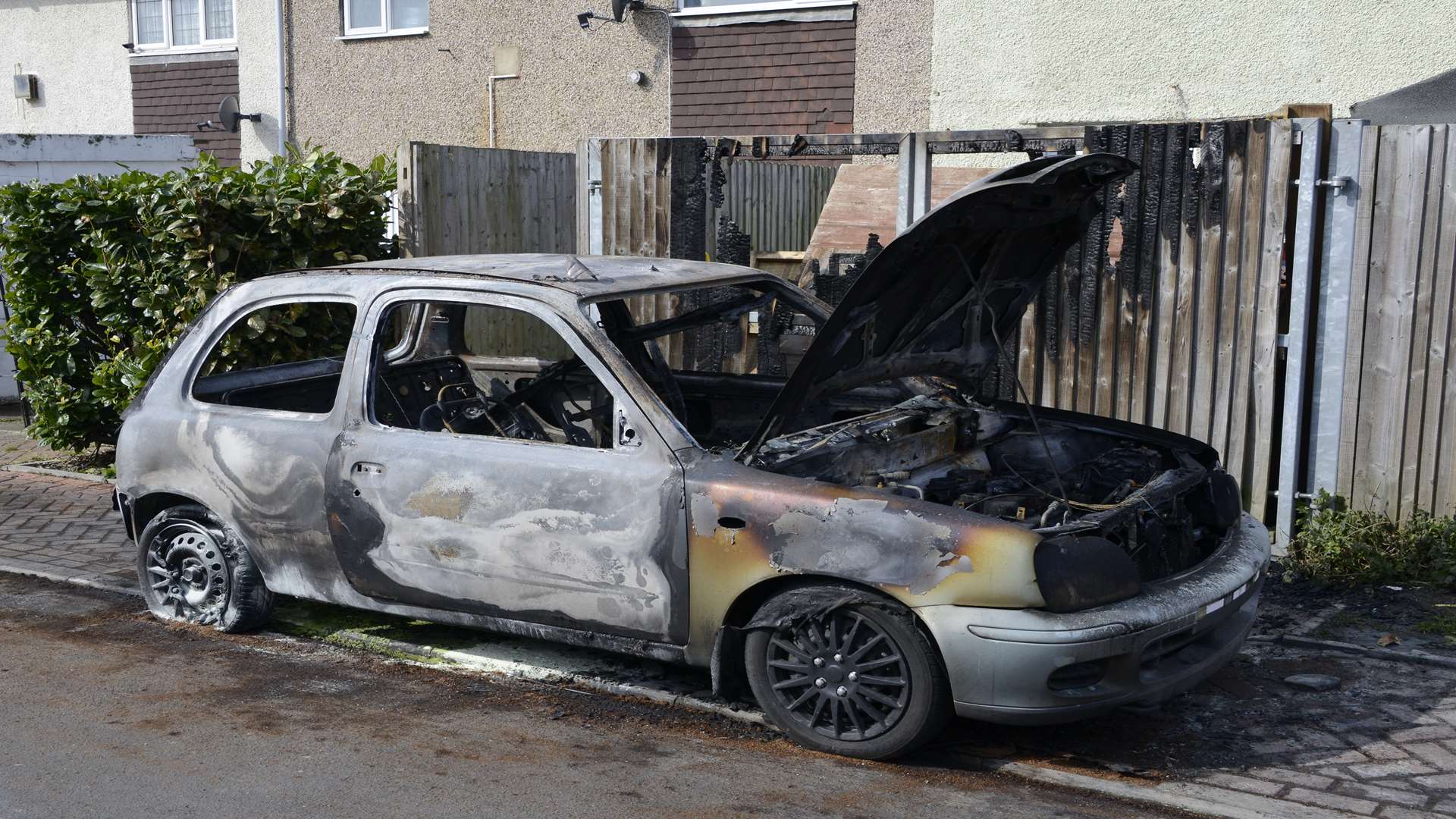 The fire ruined the car and spread to the fence