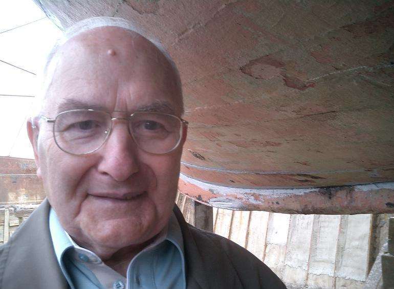 Sittingbourne builder Ray Wilson inspects the Sheppey Queen's hull in 2006 - 60 years after he helped build it