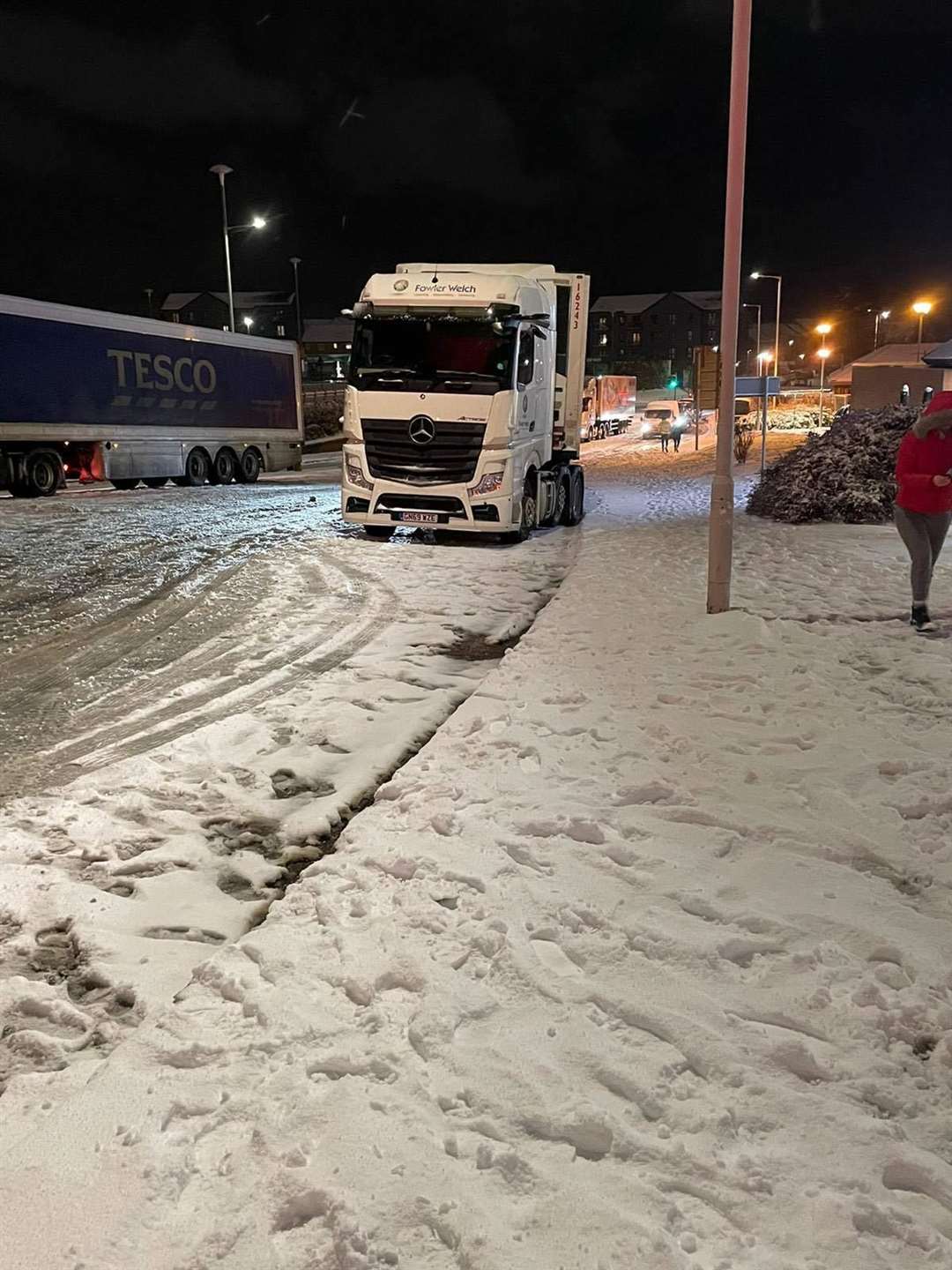 Jason Duke and Jack Duke helped haul lorries through the snow in Sittingbourne