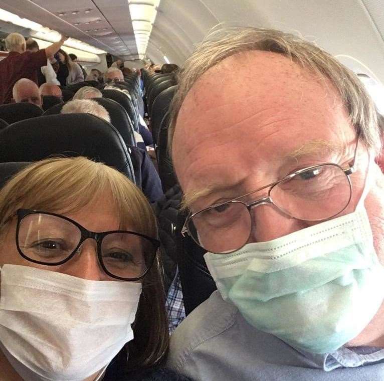 Linda and Grant on the flight home