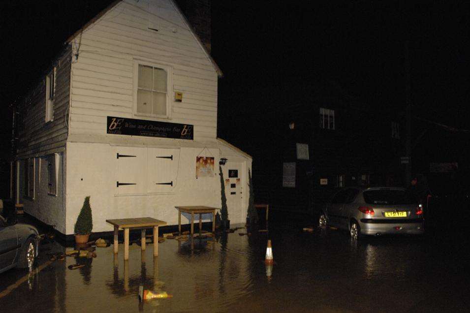 Water levels in the creek spilled over into Standard Quay in Faversham. Picture: Chris Davey