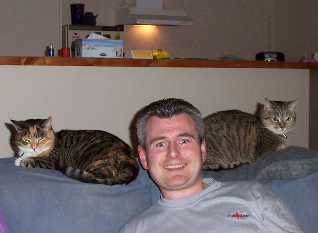 Richard Steven with his cats in New Zealand