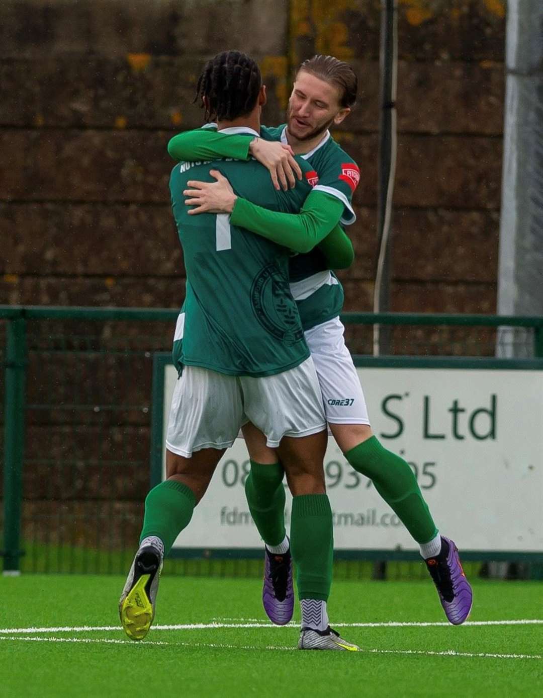 Ashford forward Bradley Ryan, right, congratulated on his equaliser against Horndean. Picture: Ian Scammell