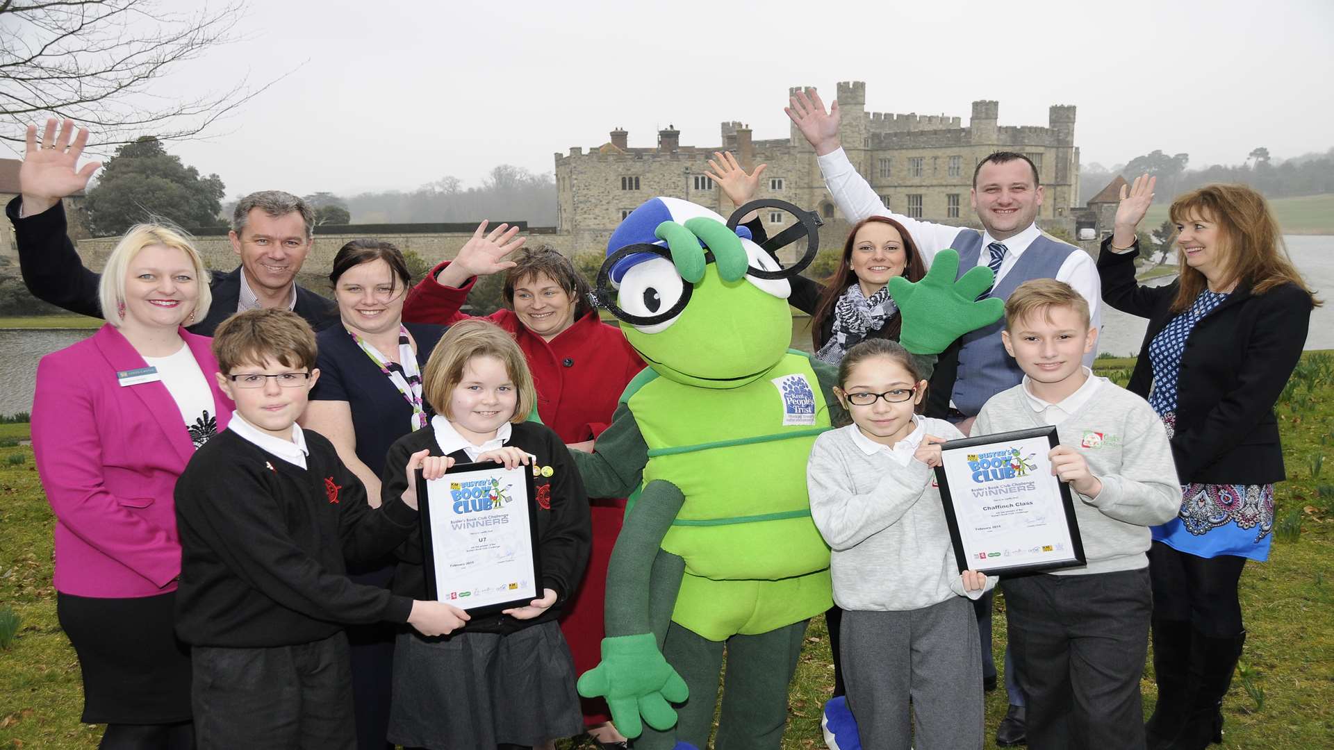 Buster's Book Club Challenge presentations at Leeds Castle: left Arthur Clarke,11, and Elise Delooze,10, Whitstable Junior School, and right Hazal Dogan,10, and Misha Garbur,11, The Oaks Primary Academy, with Buster Bug and supporters from KCC, Medway Council, Specsavers, Golding Vision (part of Golding Homes), 3R's, Countrystyle, and Mini Babybel.
