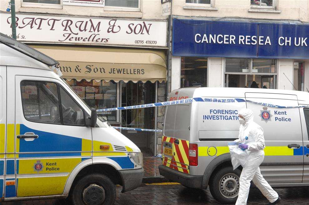 Forensic officers at Battrum & Son in Sittingbourne High Street after a raid