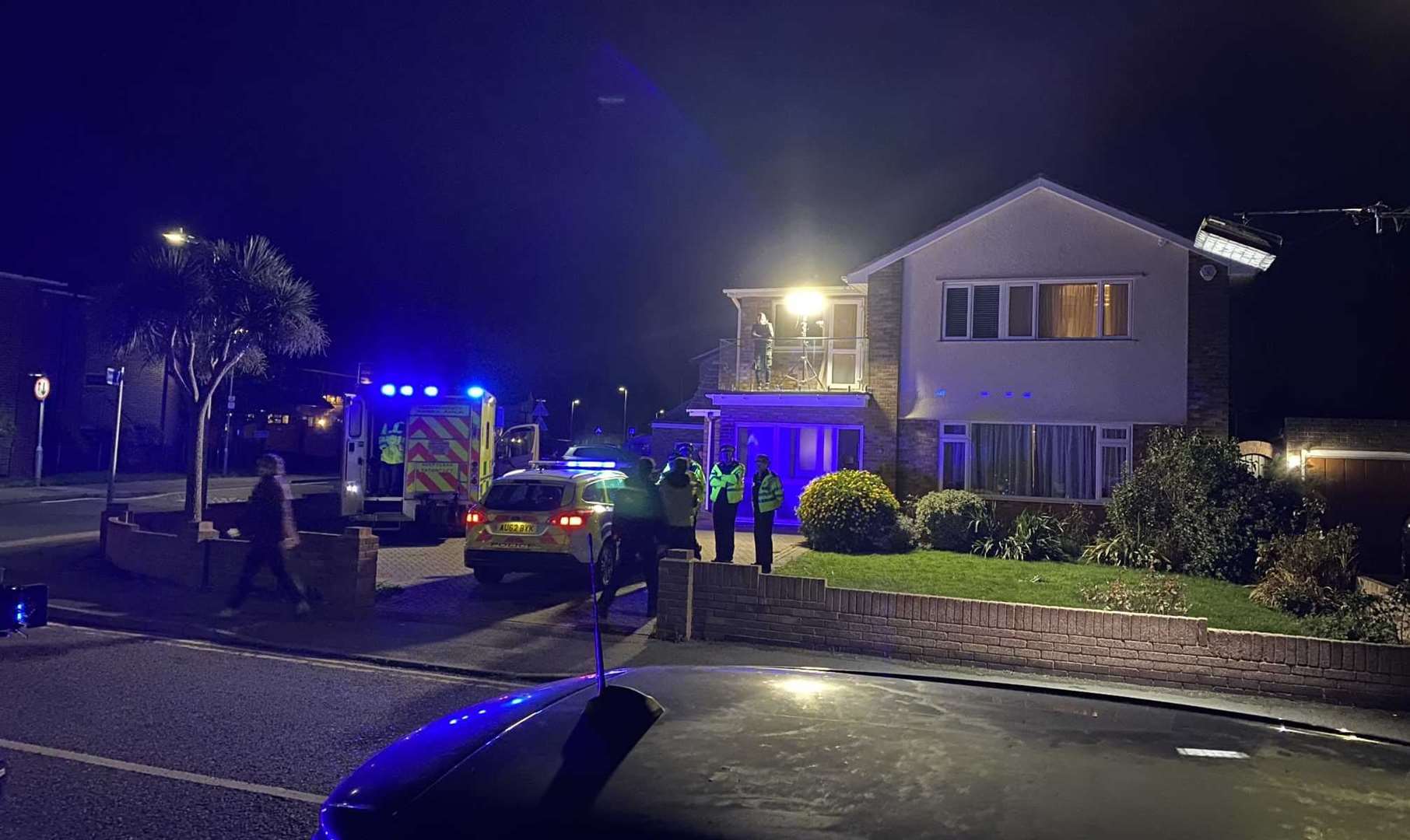 Flashing lights from a police car and ambulance turn the air blue during a Silent Witness night shoot at The Leas. Picture: Mike Fendt