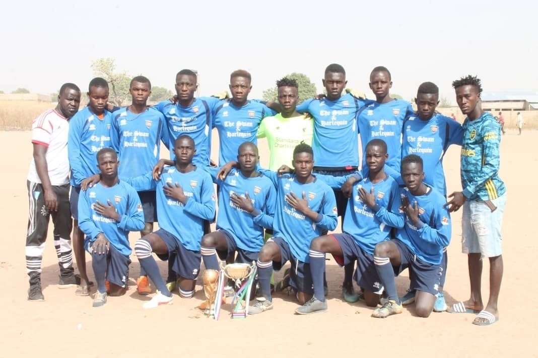 The football squad in Gambia - who are now nicknaming themselves The Swans - donning their new kit, which was sent to them by Faversham Strike Force