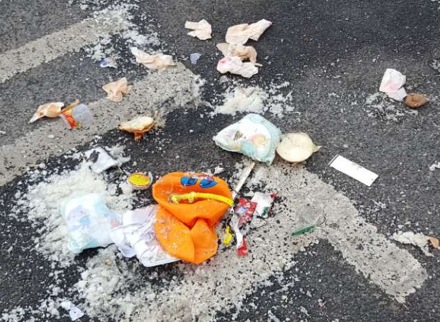 Soiled nappies among rubbish left by travellers