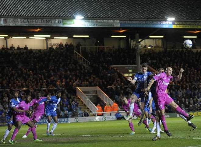 Adam Barrett (right) gets up well at London Road Picture: Ady Kerry