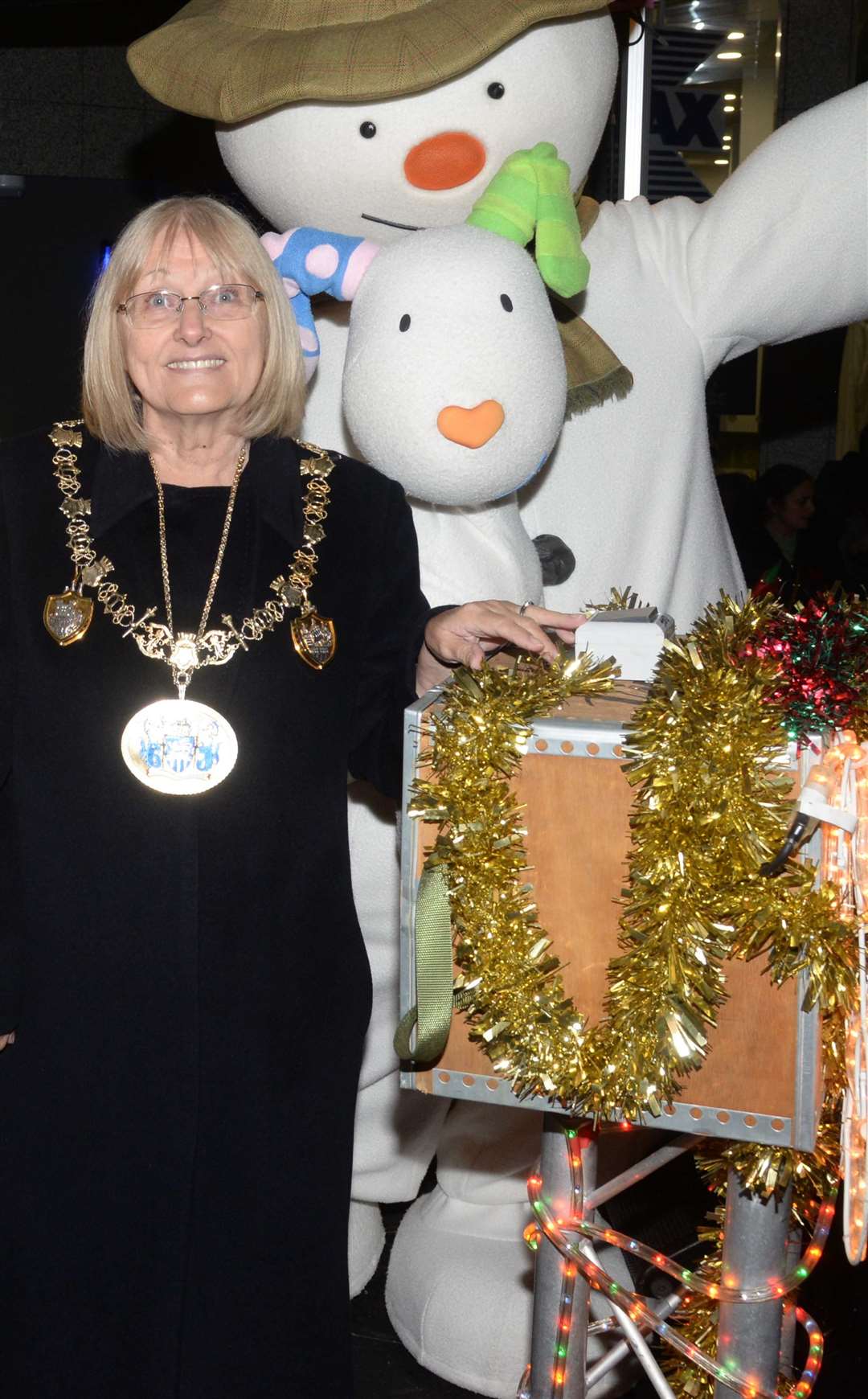 Cllr Jan Aldous turning on the power at the Chatham Christmas lights switch-on