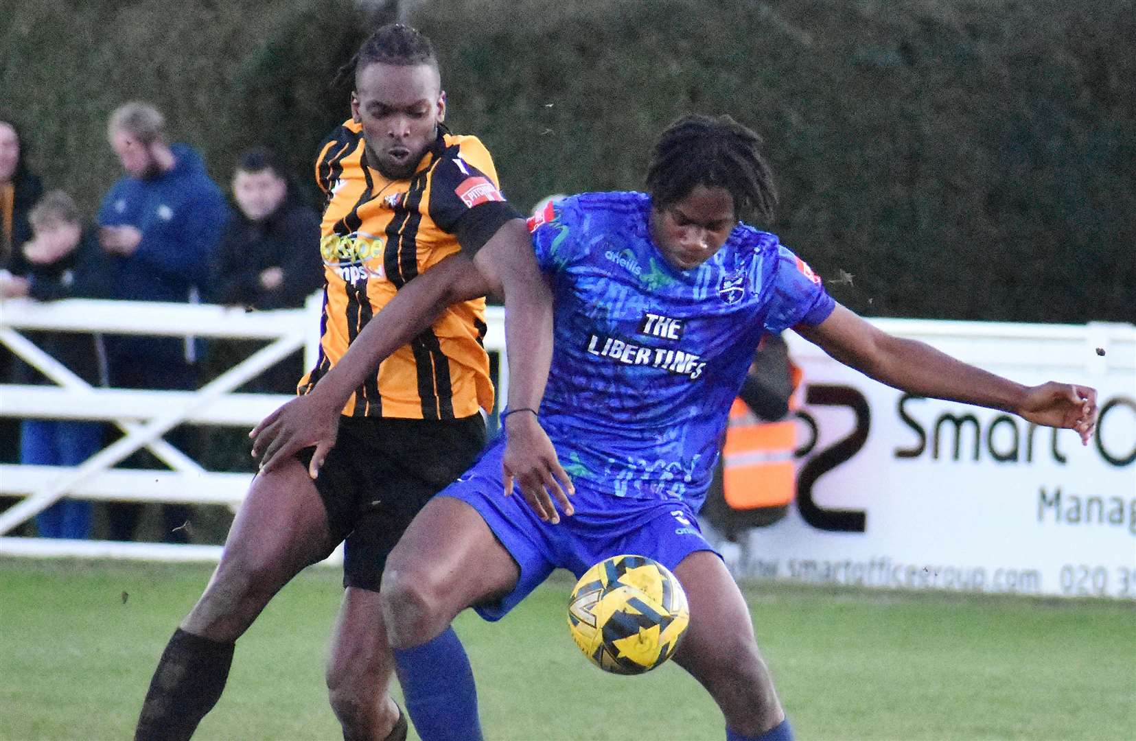Folkestone's Ibrahim Olutade gets into a tangle against Margate. Picture: Randolph File