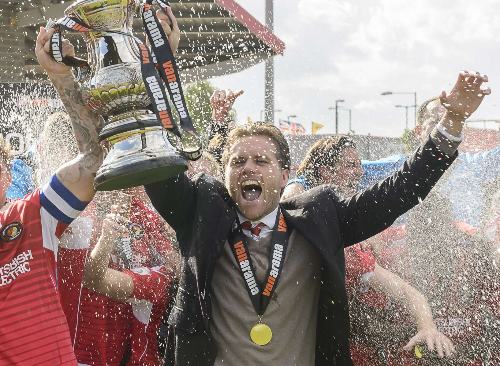 Ebbsfleet boss Daryl McMahon lifts the play-off trophy Picture: Andy Payton
