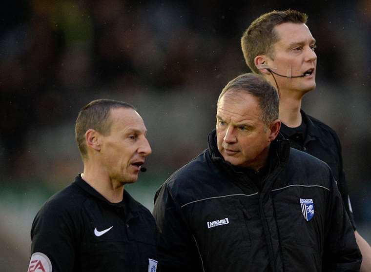 Gills boss Steve Lovell speaks to the match officials after his side were denied a goal Picture: Ady Kerry