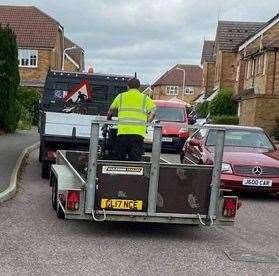 A Folkestone and Hythe District Council employee was spotted riding in the back of a trailer