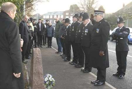 Police officers beside the marble memorial put in place in 2002. Picture: DAVE DOWNEY