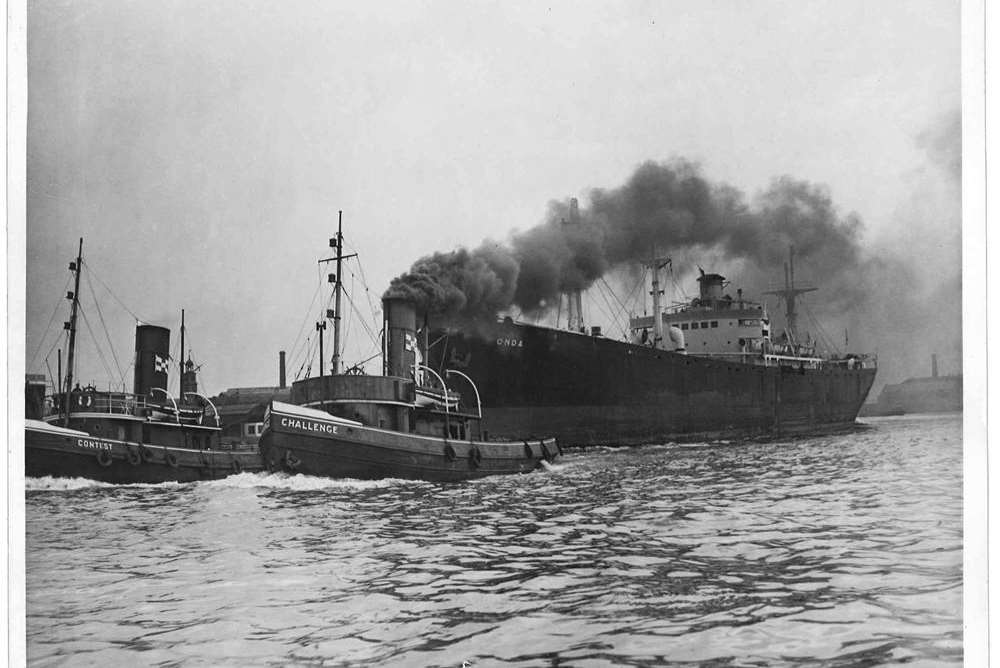 The Dick and Pages two tugs Challenge and Contest towing a liberty ship "ONDA" in the early 1950s.