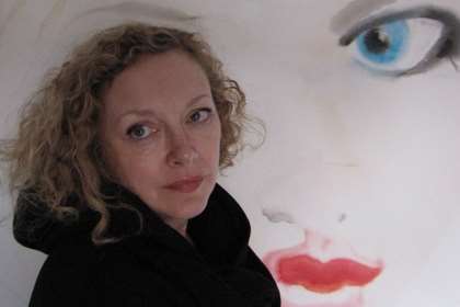 Louise Harris with one of her paintings.